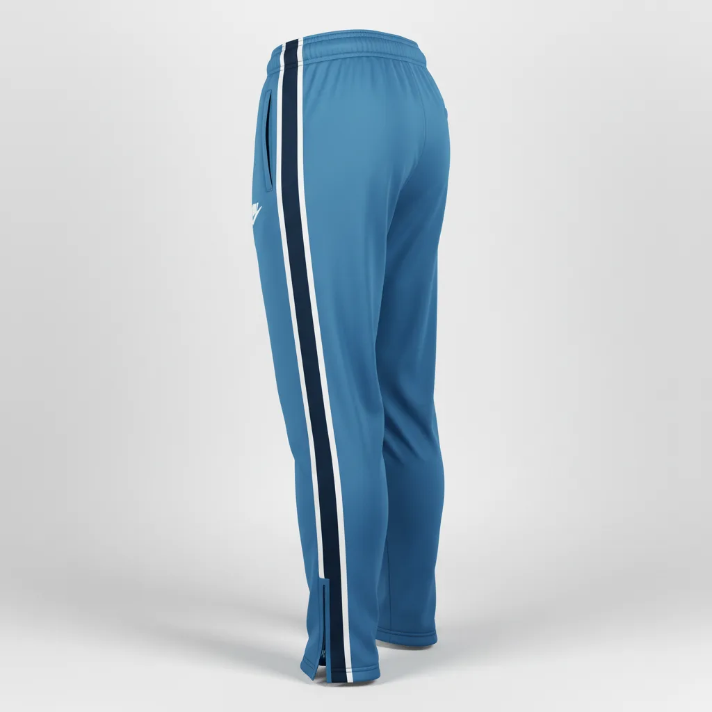 Side view of custom loose-fit soccer training pants showing the roomy straight-leg silhouette, side zip pocket, and full-leg sublimation zone