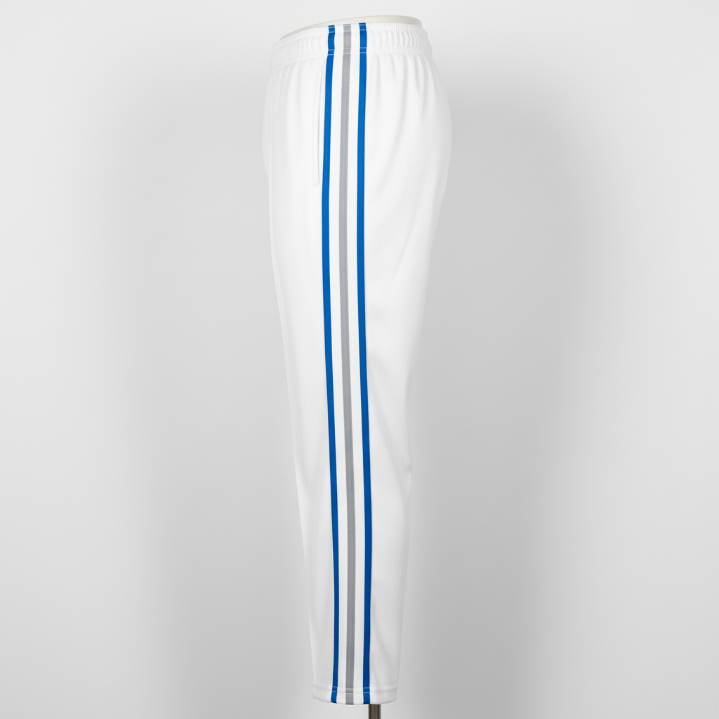 Side view of custom piped softball pants showing the full-length contrast piping down the outer leg seam
