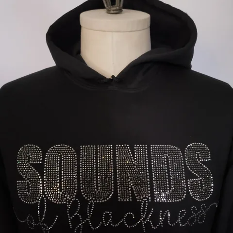 Rhinestones and hotfix example on a garment